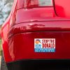 Anti Trump Bumper Sticker on Red Car