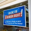 Roe is a Human Right Yard sign in window | pro choice sign